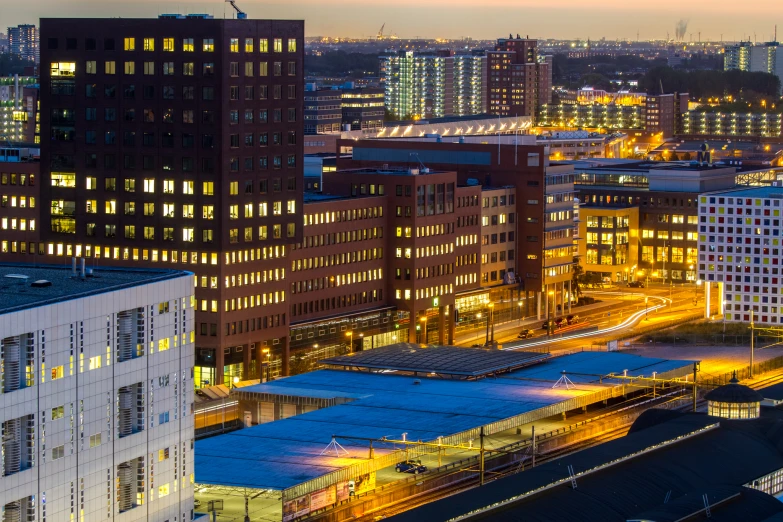 a cityscape at night with buildings lit up