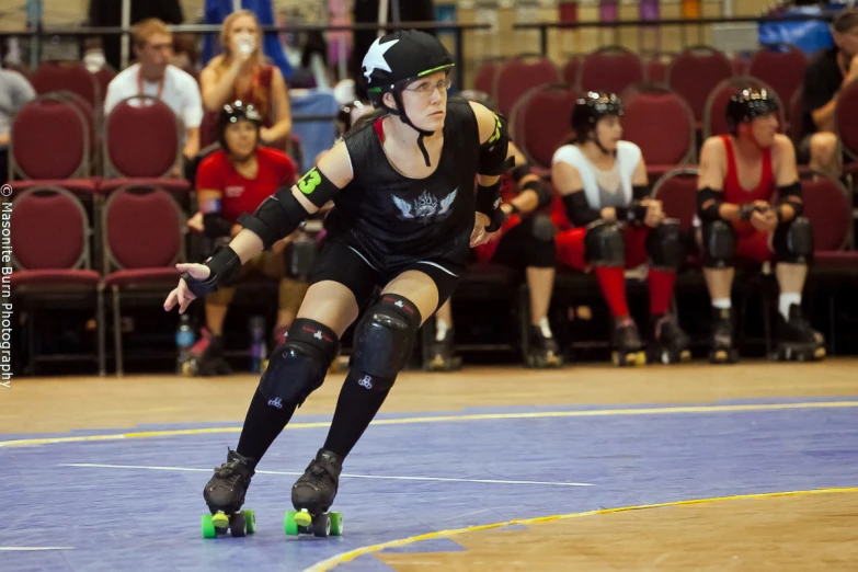 a female roller derby player in the midst of the ball