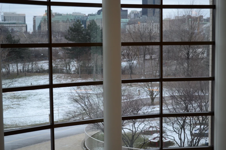 some windows and snow outside of the window