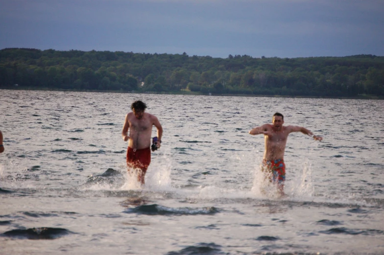 three people that are out in the water