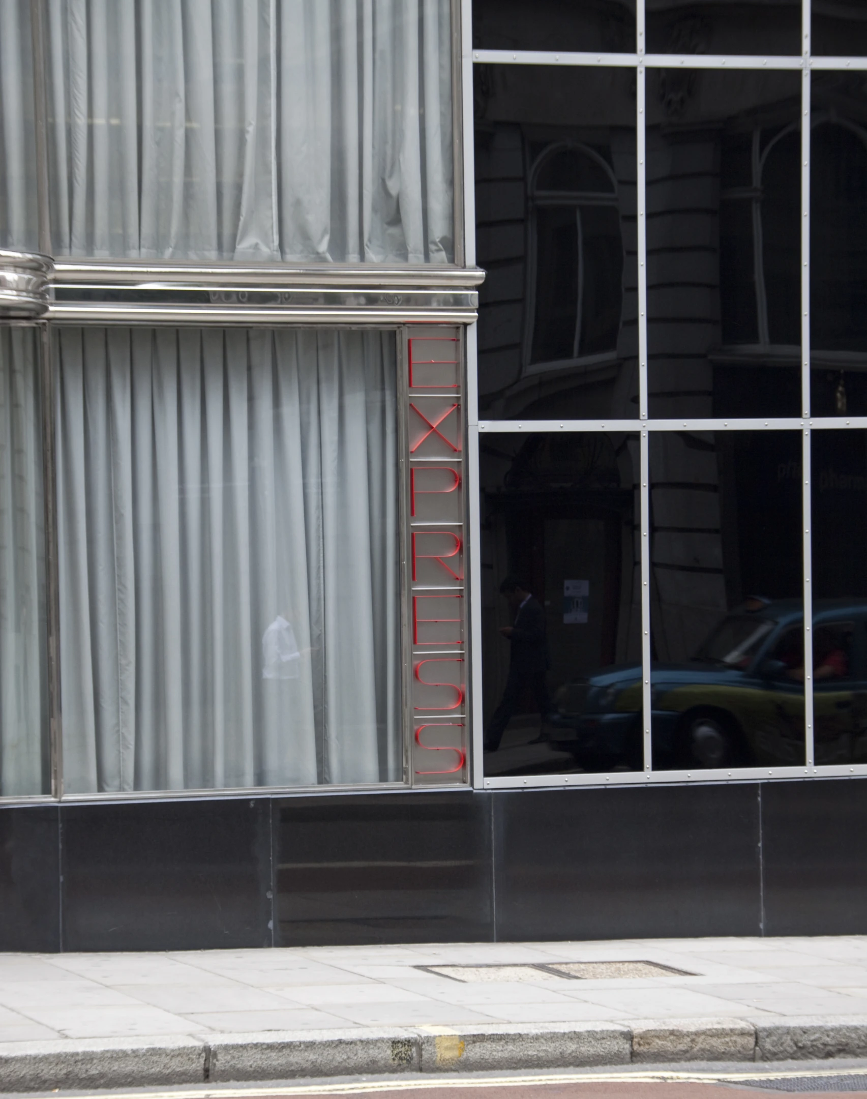 a sign is on the windows of an old building