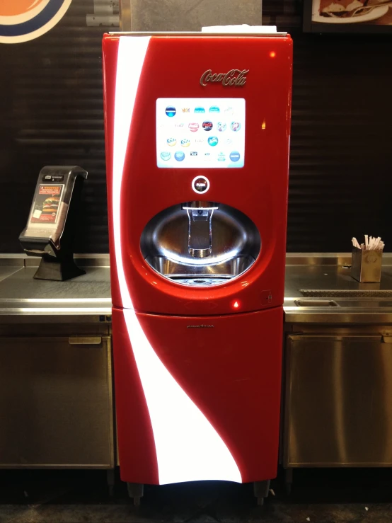 this is a red water dispenser that can be used to wash