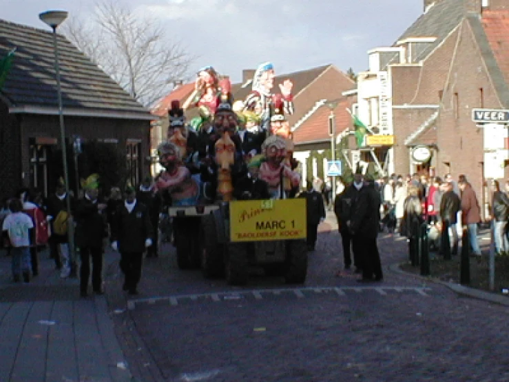 a crowd of people are walking around the street