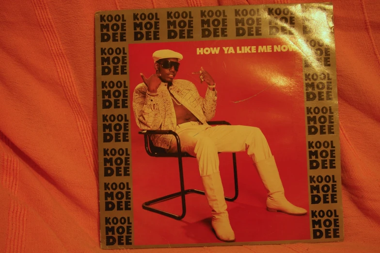 a record that has an image of a person sitting in a chair