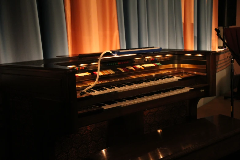 a piano in front of a window with a lot of light