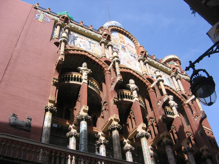 an ornate building with fancy balconies and ornamental carvings on the side