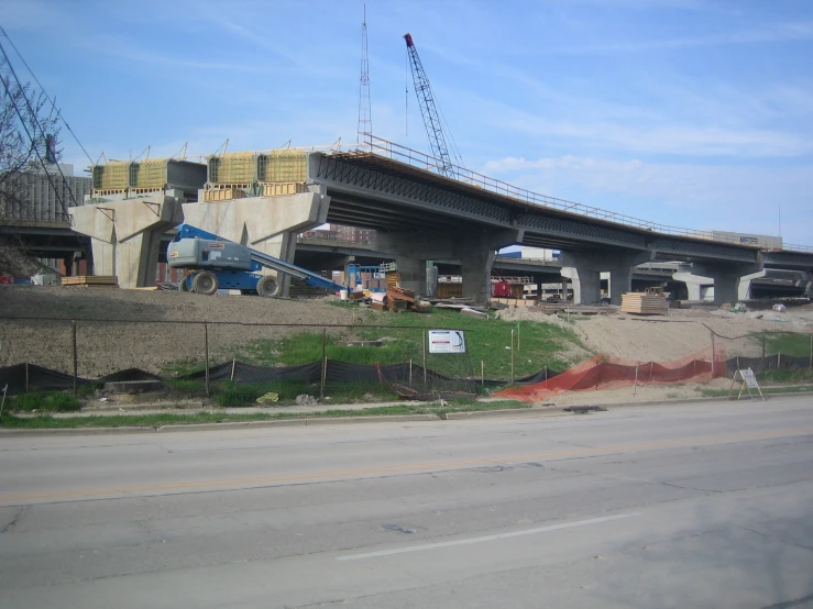 a street scene with an overpass that has been built and is being worked on