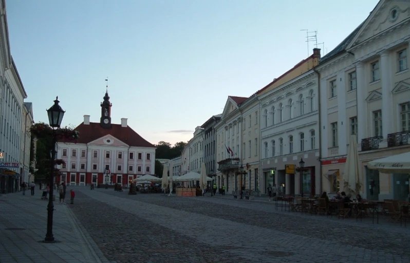 an empty road in the middle of some buildings