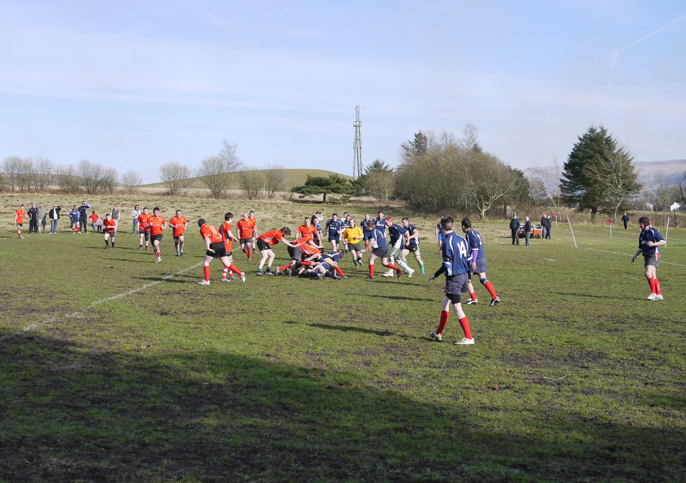 a group of young men playing soccer against each other