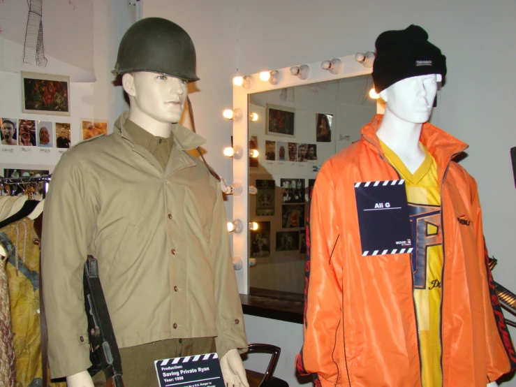 two mannequins in a clothing store displaying various styles of clothing