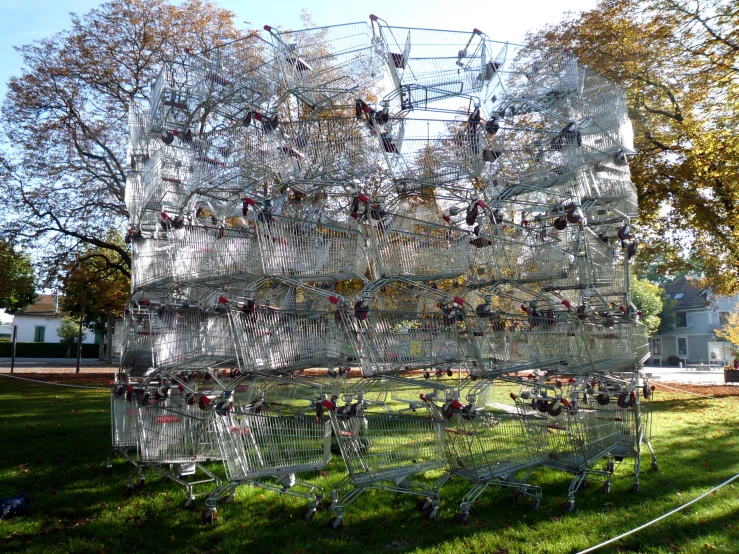 a cage with many birds attached to it