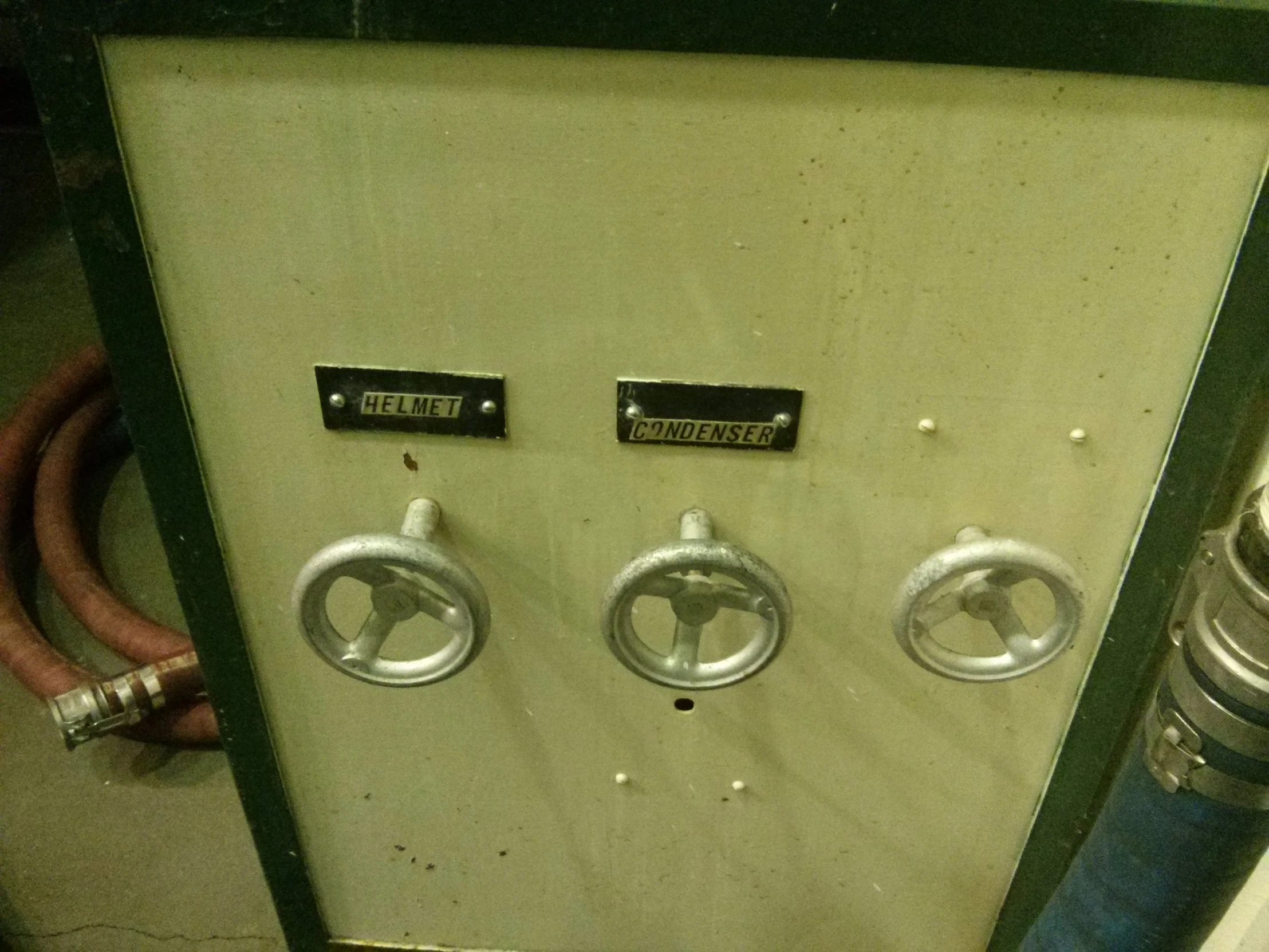 three controls on a panel that have three wires attached to them