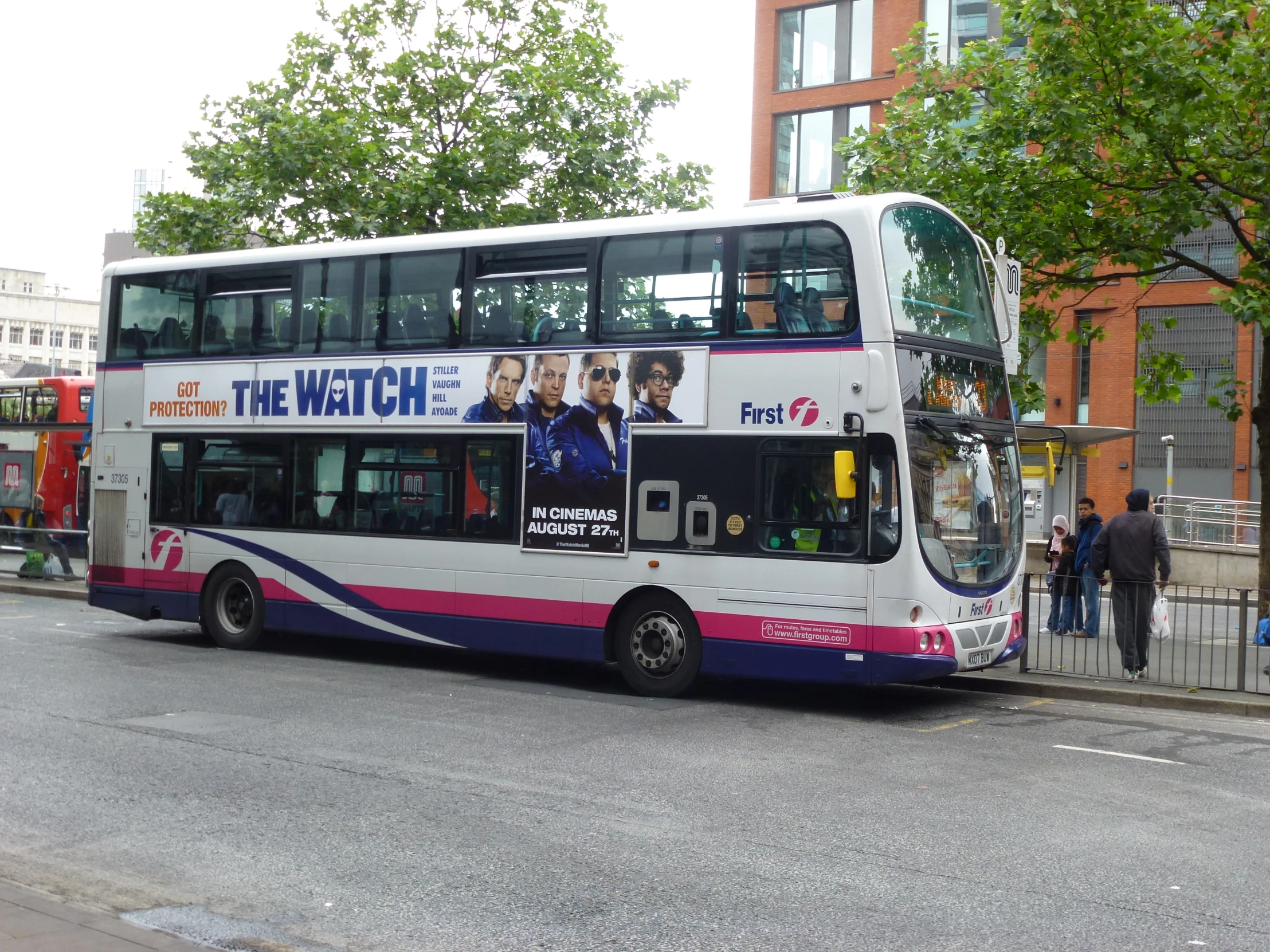 a double decker bus with two levels is on the street