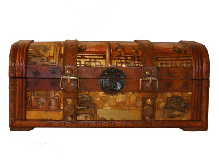 there is an old chest with decorative carvings