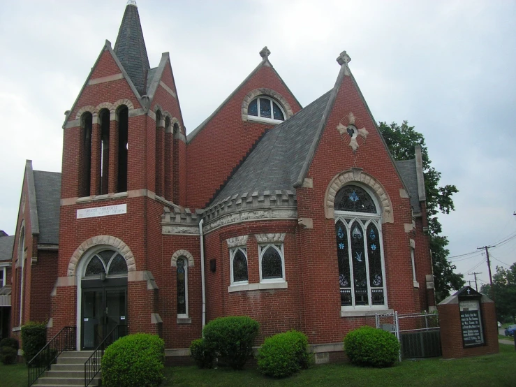 a very large brick church with gothic architecture