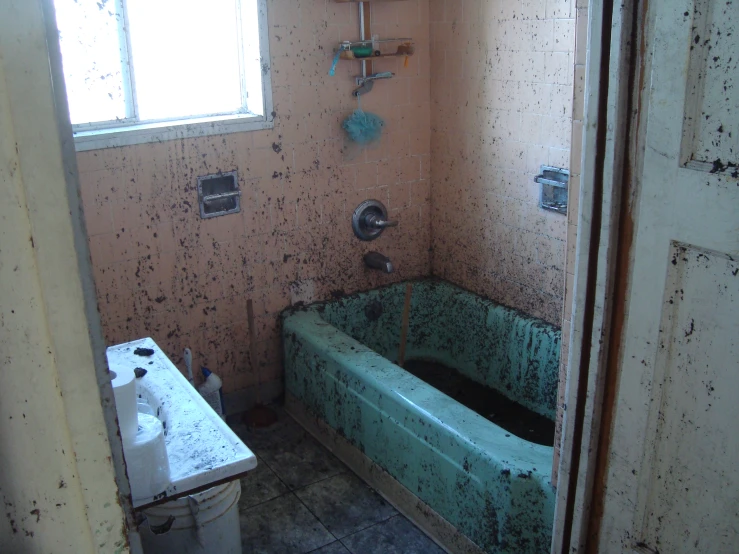 this old abandoned bathtub is covered in stains and grime