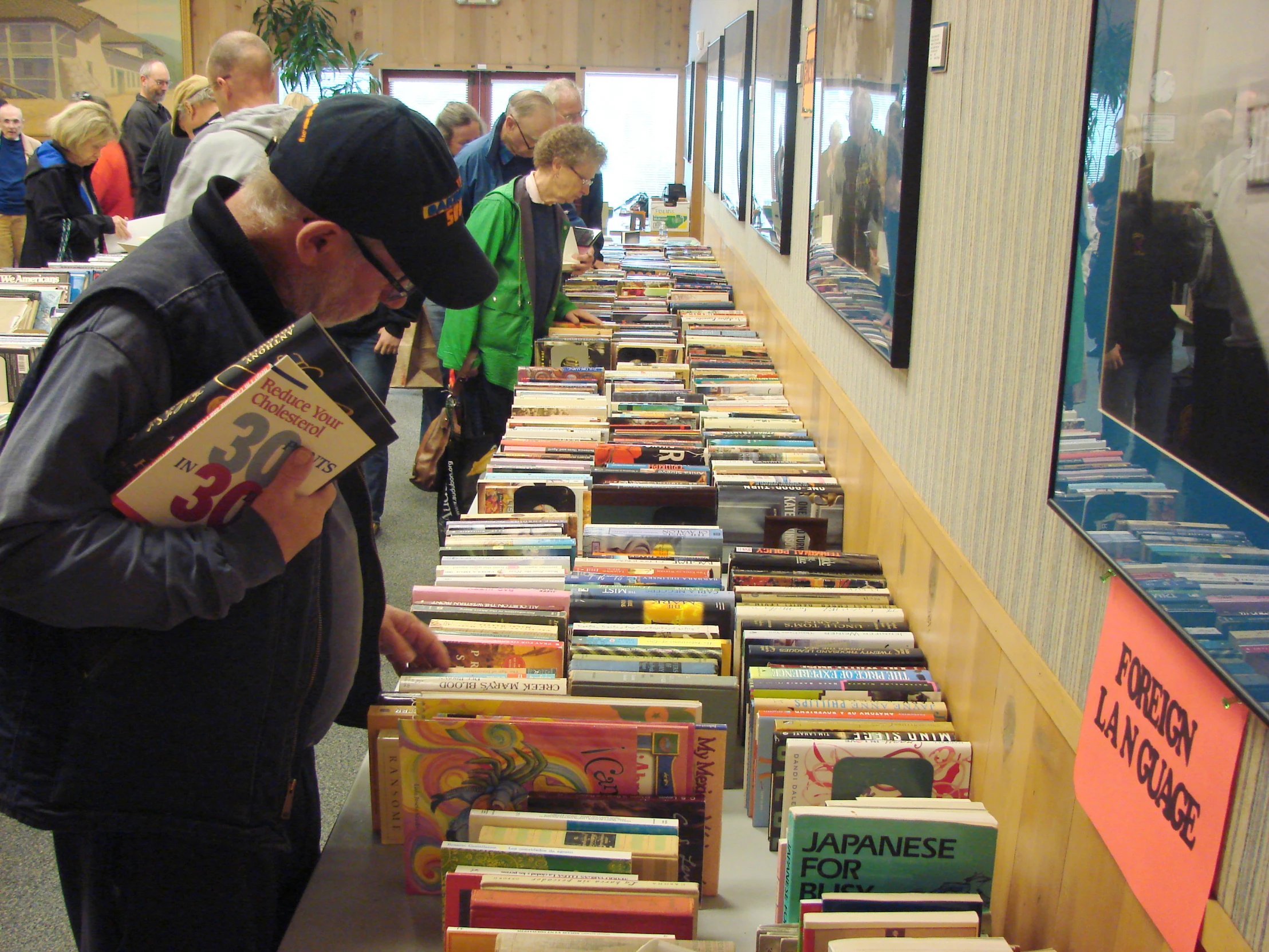 an open book store with books on tables full of books