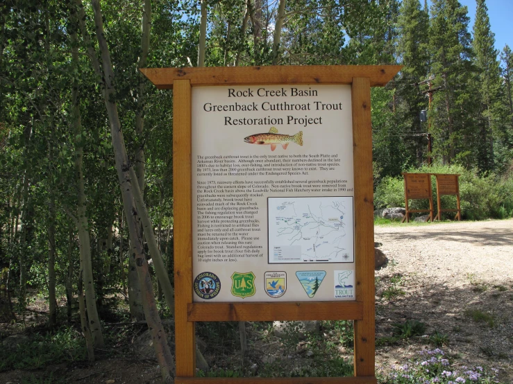 an information board is posted in the wilderness