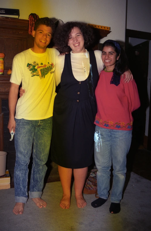 three smiling young people posing for a picture