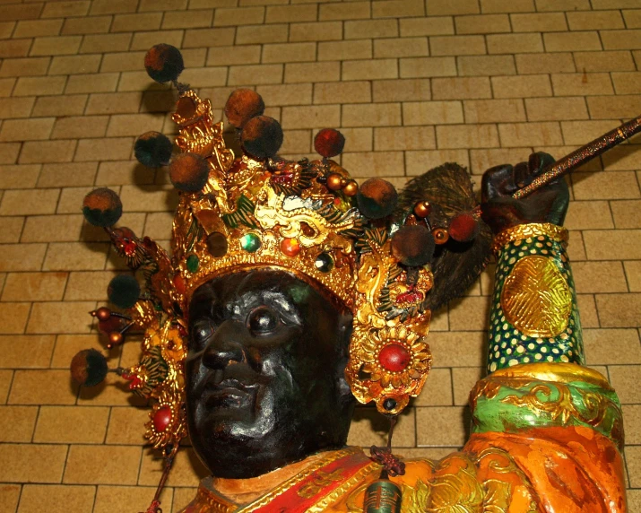 a large statue of a man wearing headdress