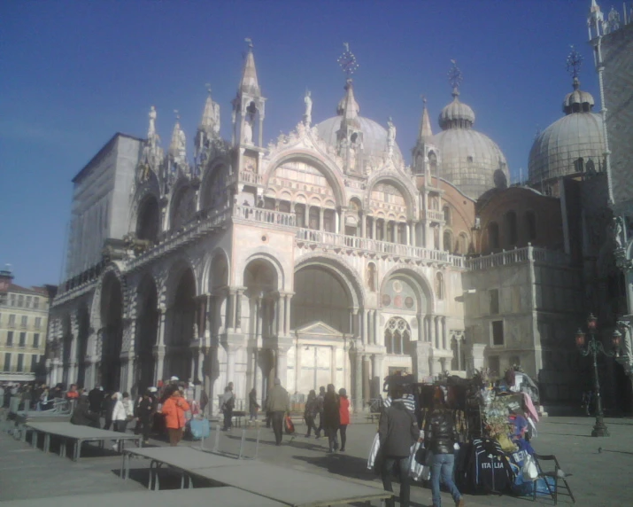 a very ornate building with a lot of people outside it