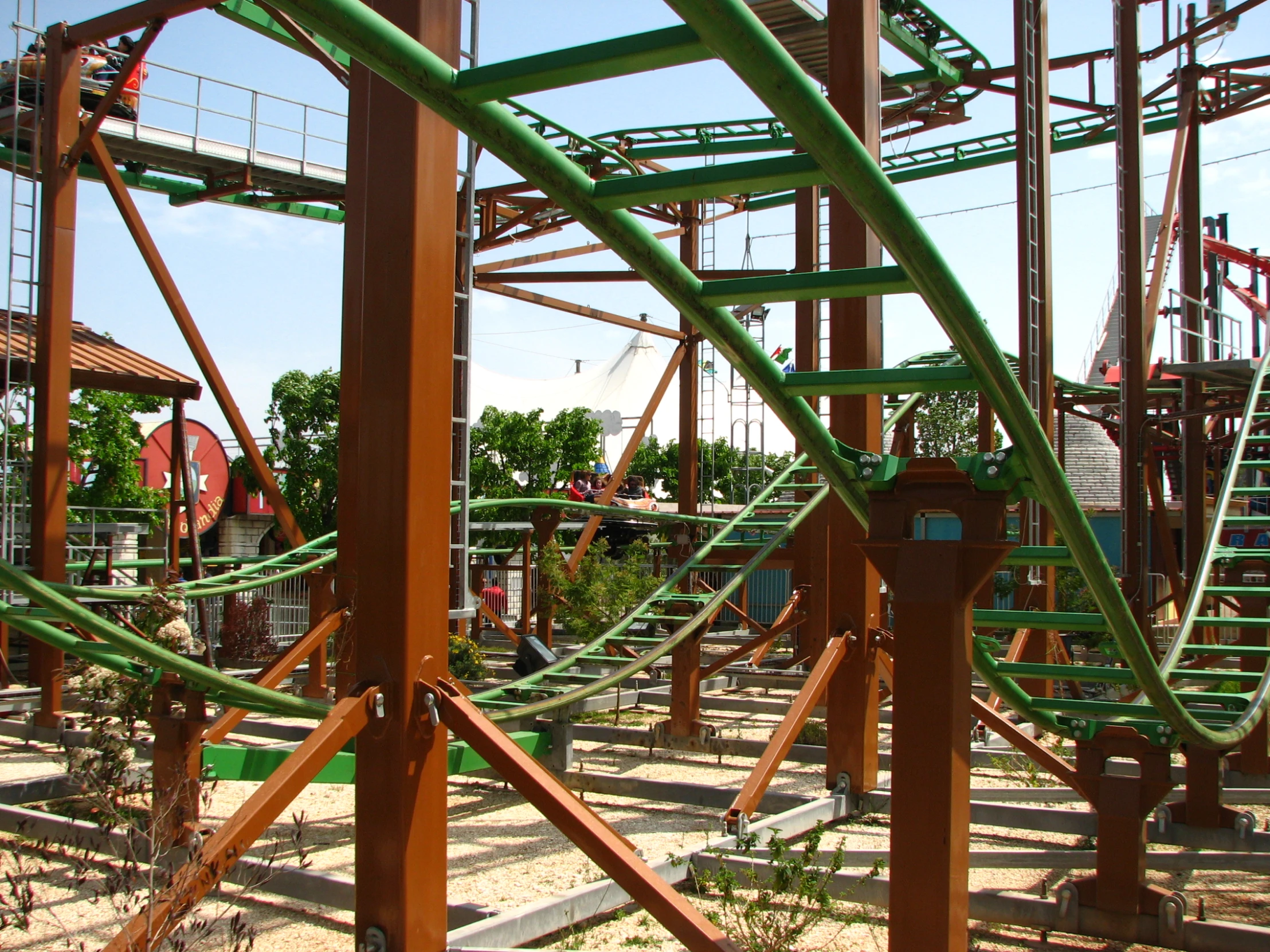 several roller coasters on an outdoor ride