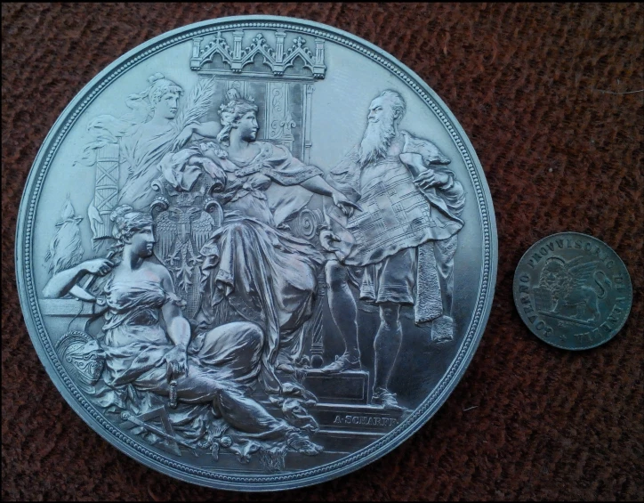 a coin is pictured on a table with an image of people