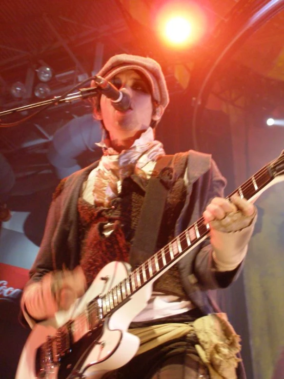 man wearing a funny outfit playing a guitar