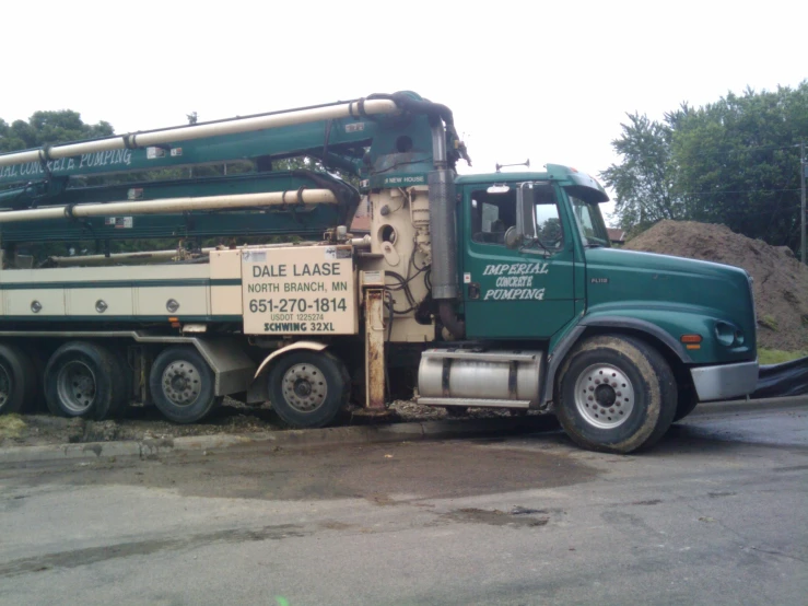 the large truck is carrying pipes and equipment