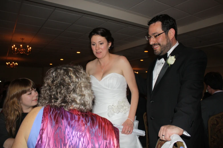 a bride and groom  their wedding cake