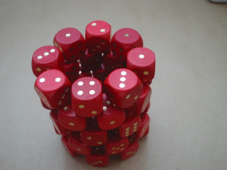 a small stack of dices on a white surface