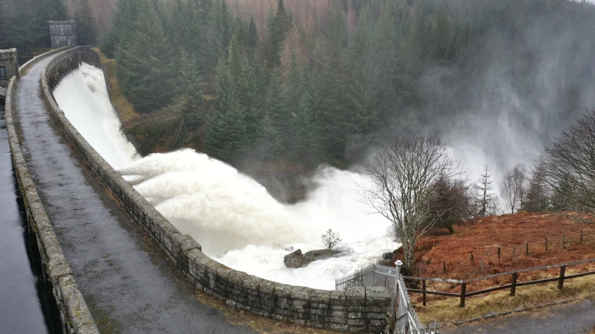 a bridge that has rapids and lots of water on top of it