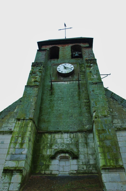 there is an old tower with a clock on it