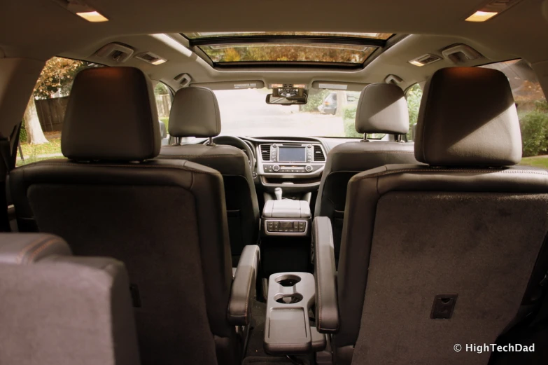 a car with a laptop and other electronics in the back