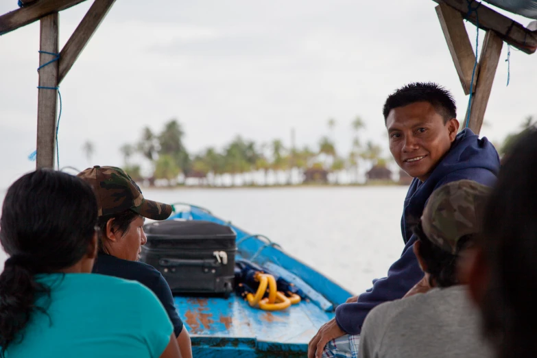 a man on a boat smiles for the camera