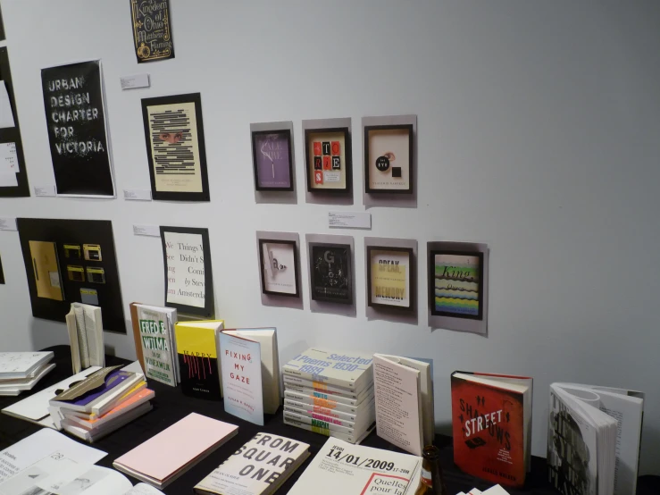 a desk with lots of cards and posters on it