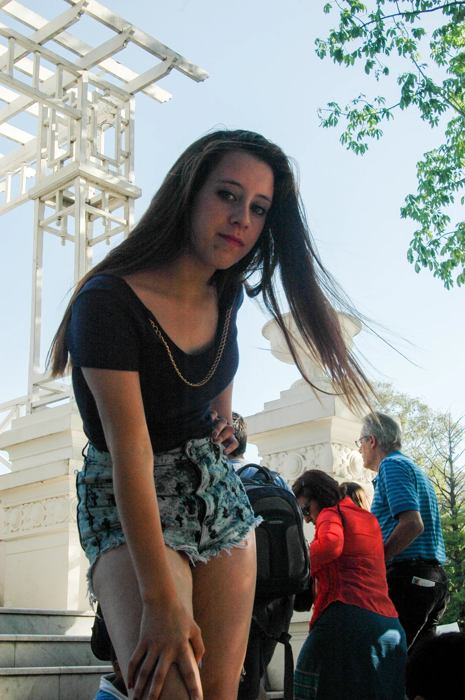 a  wearing shorts sits on a bench