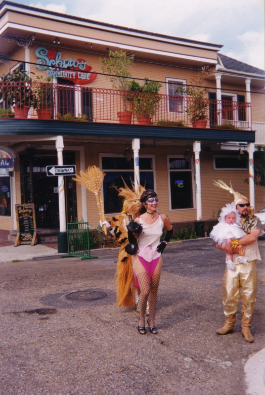 two people dressed in costume standing outside of a store