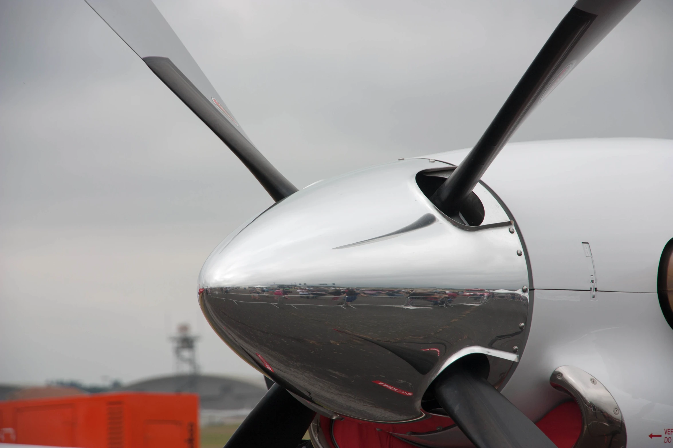 an airplane that is shiny with some black handles