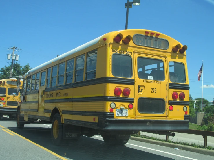 a couple of school buses that are parked on the street