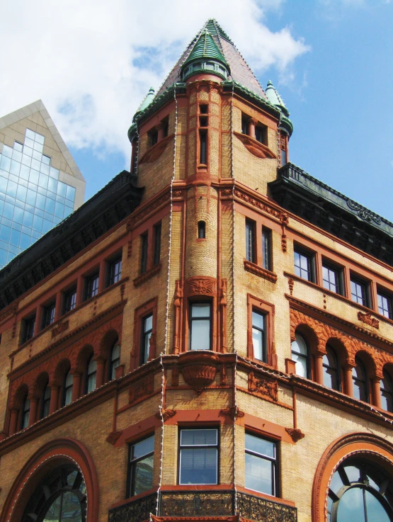 a tall building with windows and a clock on top