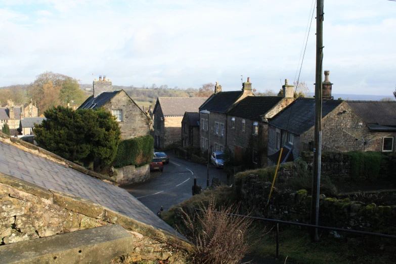 houses lining a rural city street as seen from a bridge