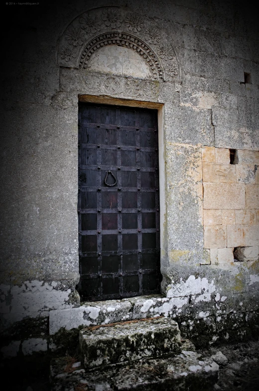 this is a door that is closed in an old building