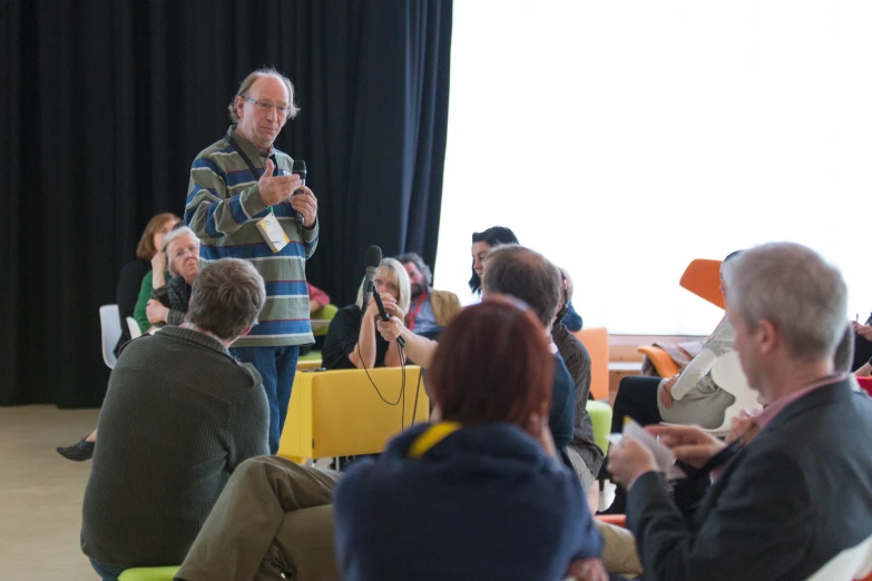 an audience of people watching a presentation