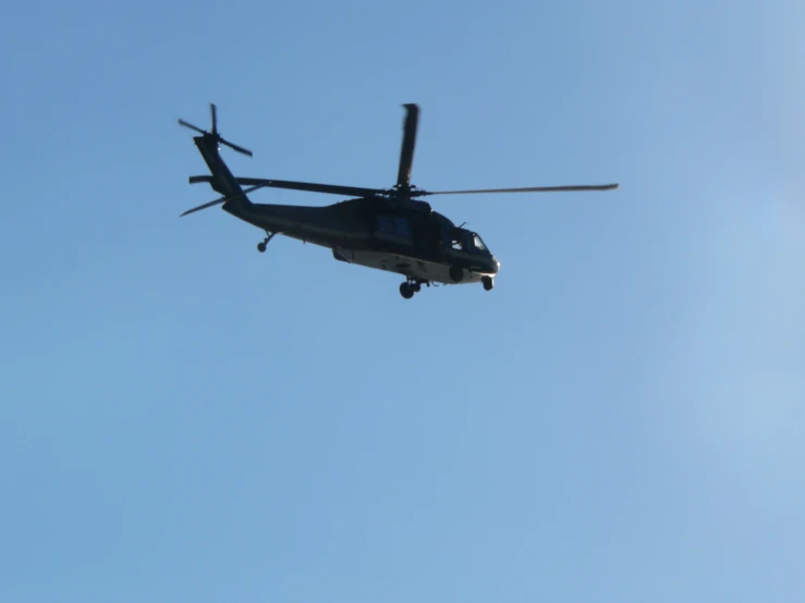 the black helicopter has two blades on the wings