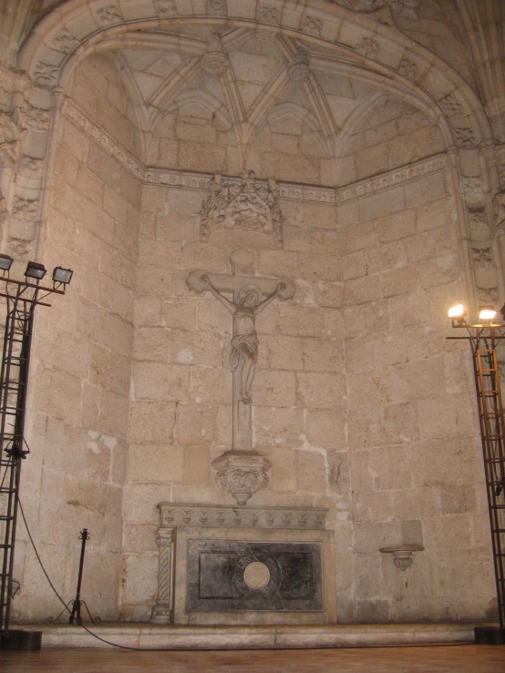 the statue of jesus is on display in a stone building