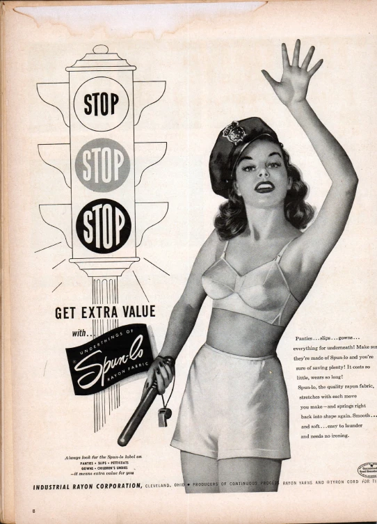 a woman is smiling while wearing underwear and holding a baseball bat