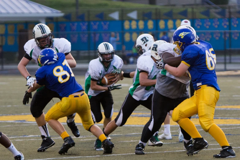 a football player is running with the ball