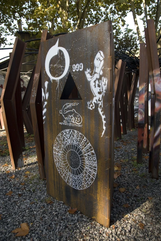 a collection of wooden sculptures are sitting on the ground