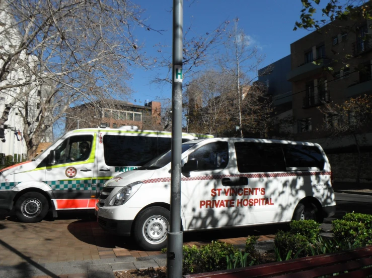 two ambulances are parked next to each other